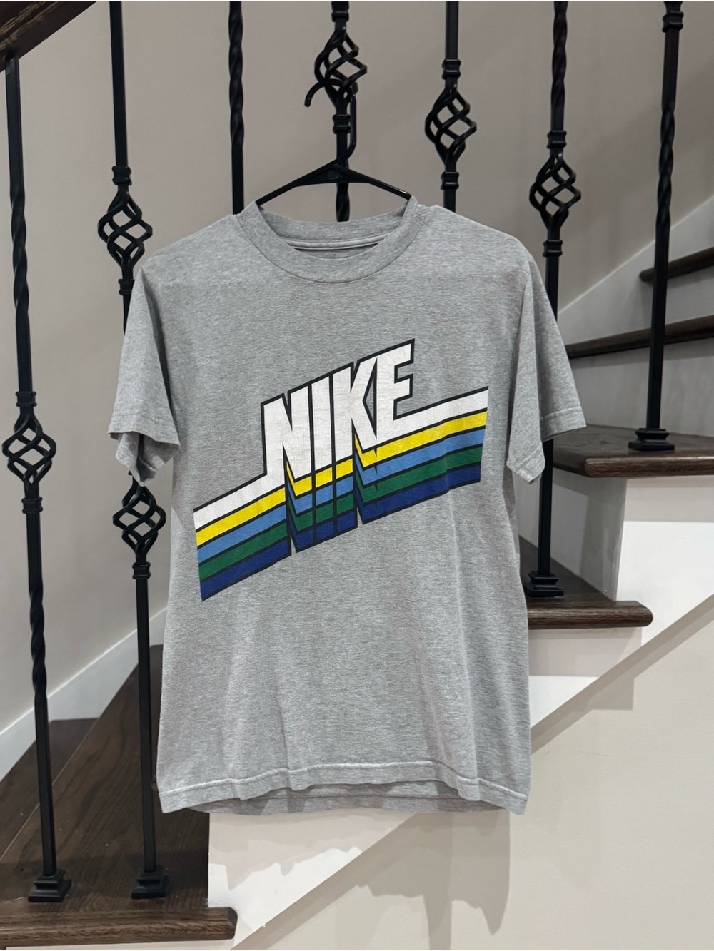 Nike Sportswear graphic tee with a retro striped logo